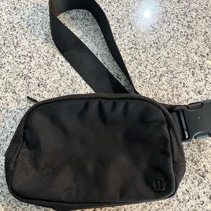 All black Lululemon belt bag
